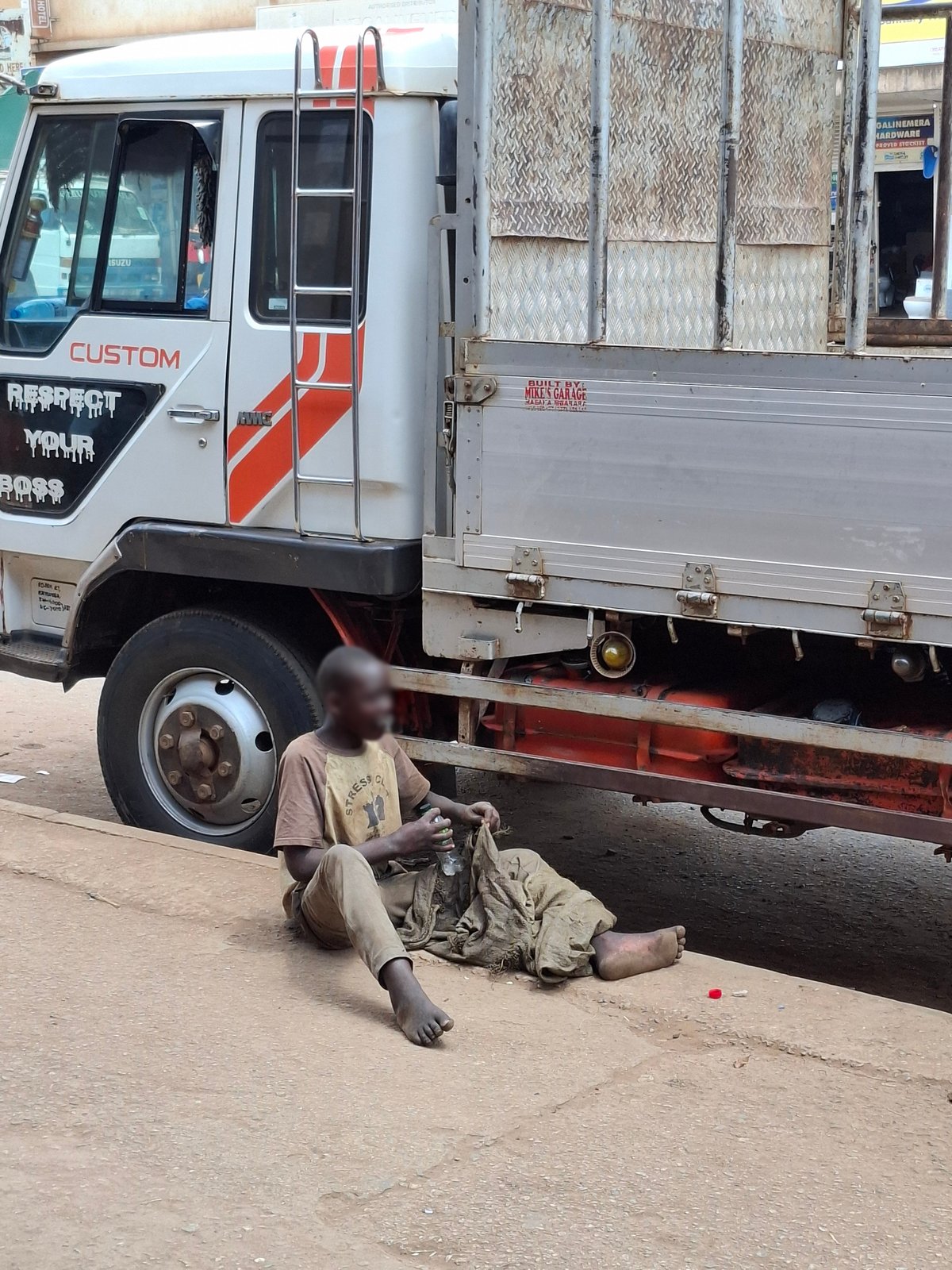 A street scene reflecting the realities faced by street-connected children in Uganda